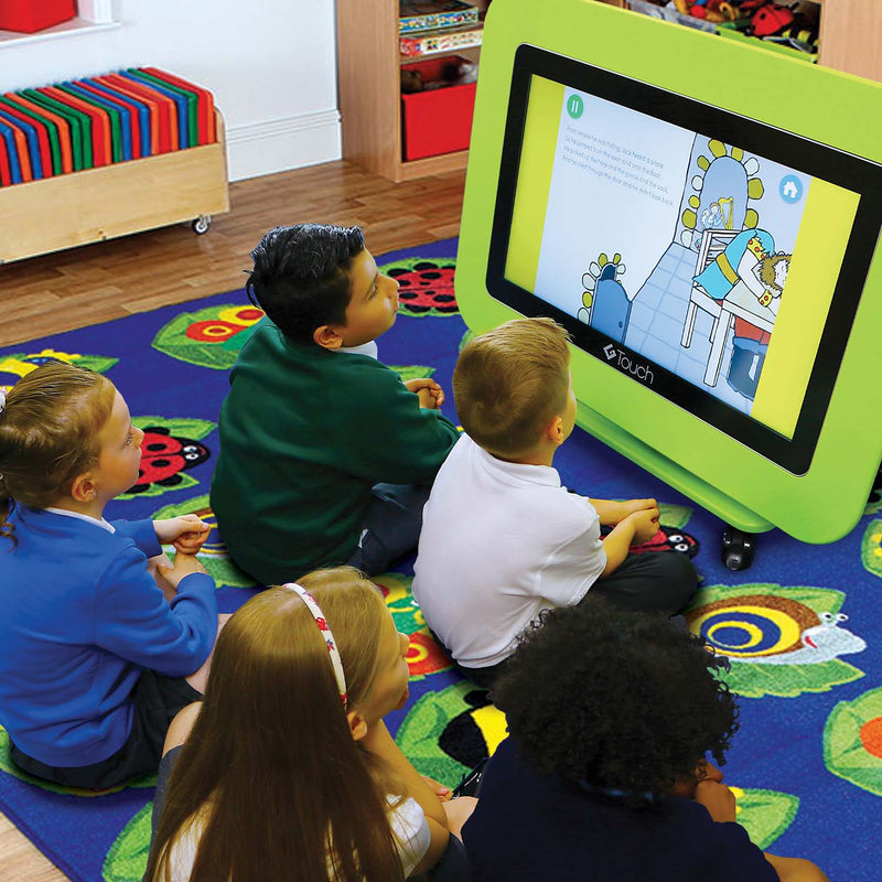 group of school children watching Yellow Door story time on the 43 inch G-Touch Table