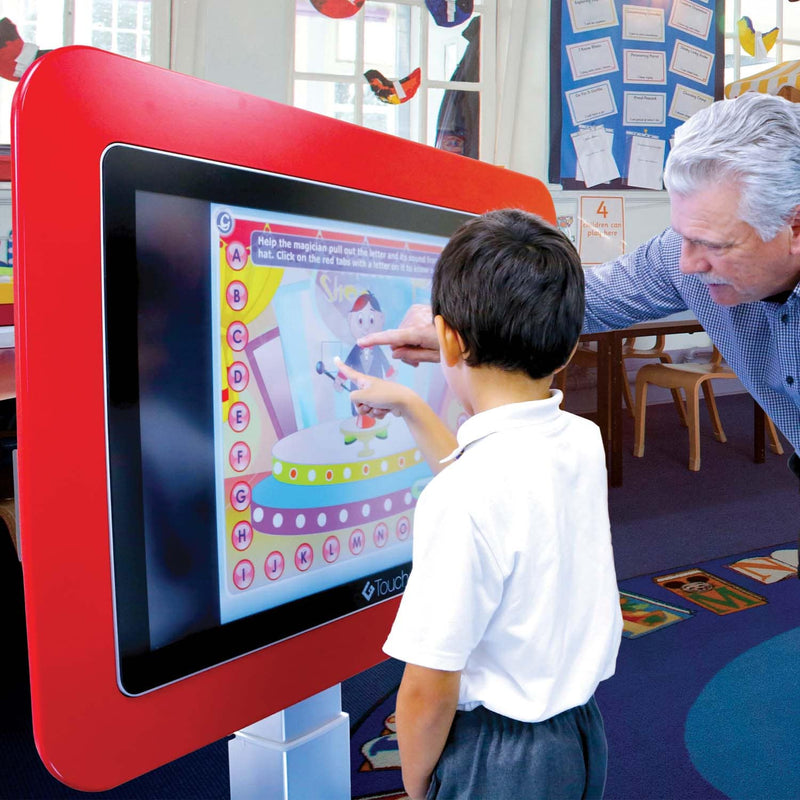 image of young school child with teacher using the 43 inch high-low g-touch table
